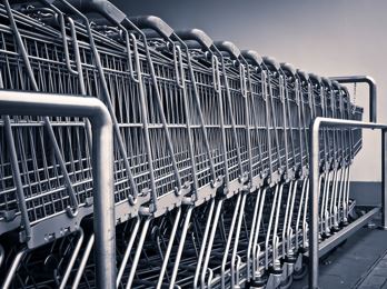 a bunch of silver shopping carts