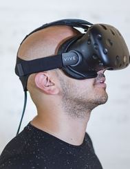 man looking up with virtual reality goggles on